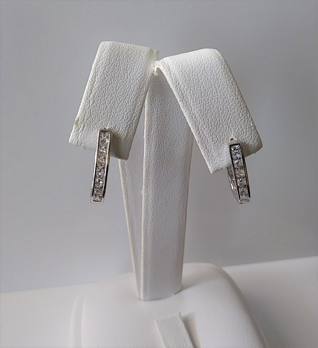 Sterling Silver and Cubic Zirconia Oval Huggie Earrings