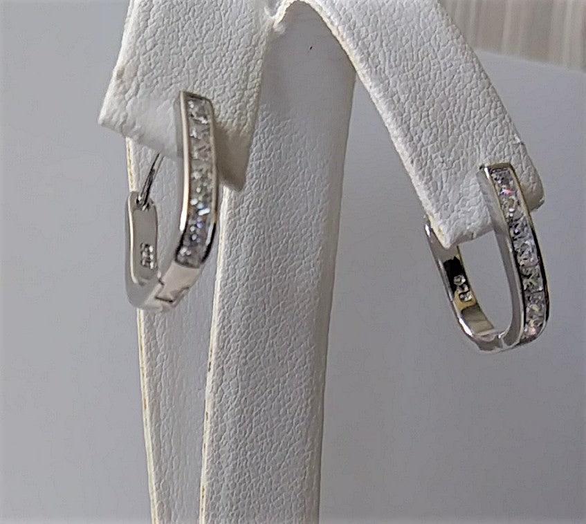 Sterling Silver and Cubic Zirconia Oval Huggie Earrings